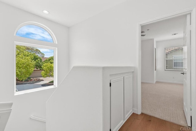 6180 Citracado Cir, Carlsbad, CA 92009 - hall with wood finished floors and recessed lighting