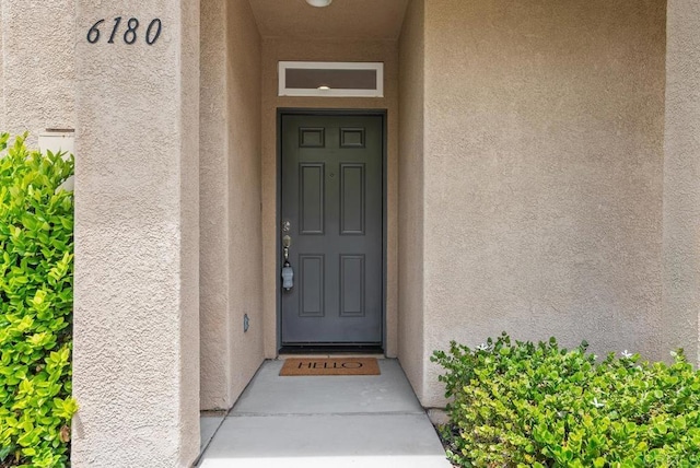 6180 Citracado Cir, Carlsbad, CA 92009 - property entrance with stucco siding