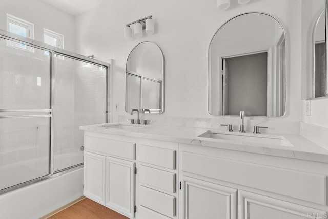 6180 Citracado Cir, Carlsbad, CA 92009 - full bathroom featuring shower / bath combination with glass door and double vanity