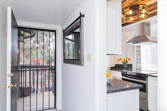 2157 Arnold Way Unit 821, Alpine, CA 91901 - kitchen featuring electric stove, wall chimney range hood, white cabinets, dark stone countertops, and baseboards