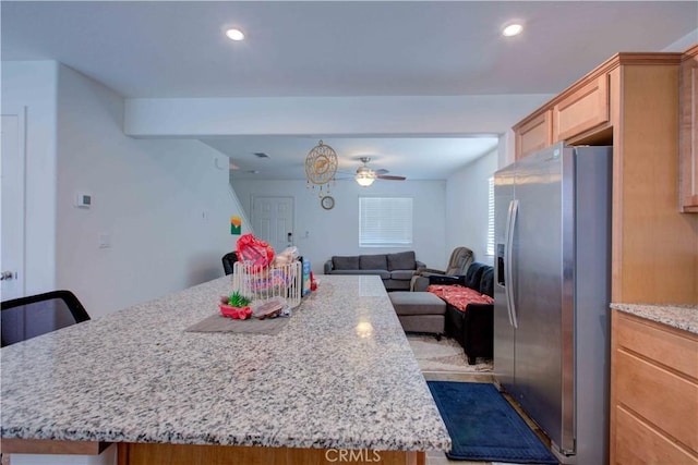 2045 Conadria Ave, Chowchilla, CA 93610 - kitchen with stainless steel refrigerator with ice dispenser, open floor plan, recessed lighting, ceiling fan, and a center island