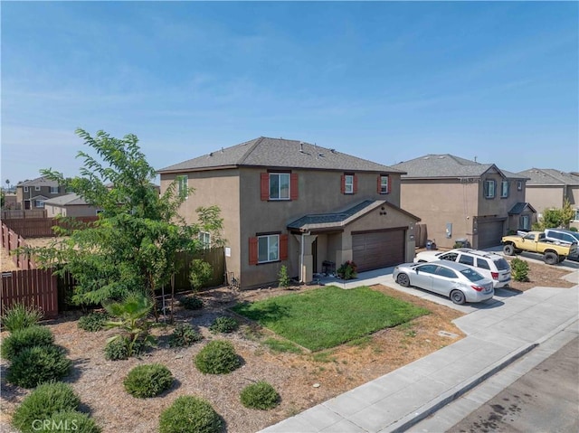 2045 Conadria Ave, Chowchilla, CA 93610 - traditional home with stucco siding, concrete driveway, a residential view, and a garage