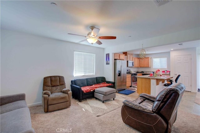 2045 Conadria Ave, Chowchilla, CA 93610 - living area featuring a ceiling fan and light carpet