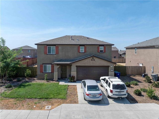2045 Conadria Ave, Chowchilla, CA 93610 - traditional home featuring stucco siding, concrete driveway, and a shingled roof