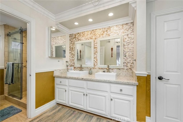19151 Fowler Ave, North Tustin, CA 92705 - bathroom featuring ornamental molding, double vanity, a shower stall, and baseboards