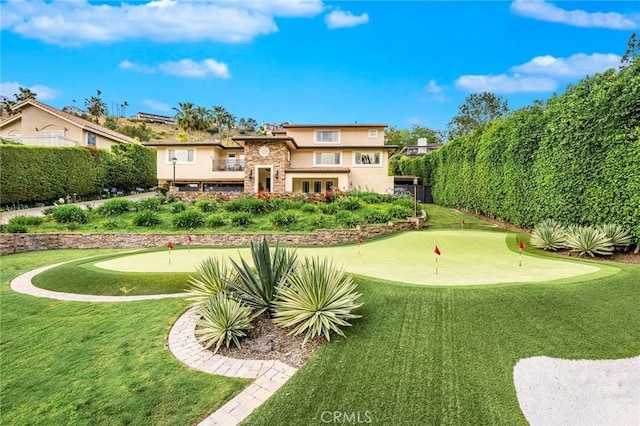 19151 Fowler Ave, North Tustin, CA 92705 - rear view of house featuring a putting green, stucco siding, and stone siding