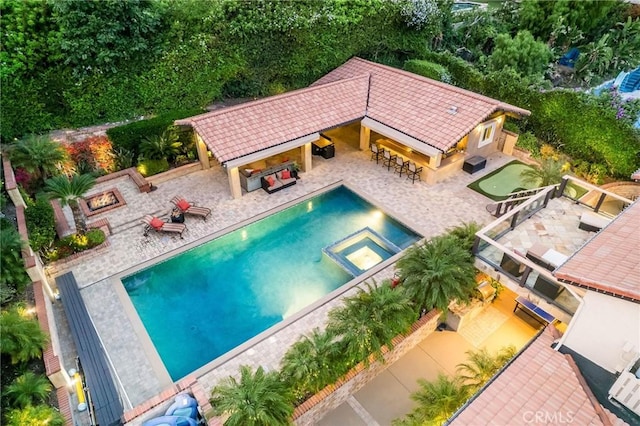 19151 Fowler Ave, North Tustin, CA 92705 - view of swimming pool featuring a patio, a pool with connected hot tub, and an outdoor living space with a fireplace