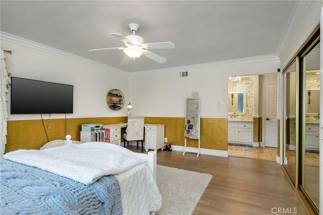 19151 Fowler Ave, North Tustin, CA 92705 - bedroom featuring light wood finished floors, ornamental molding, ensuite bath, ceiling fan, and a sink