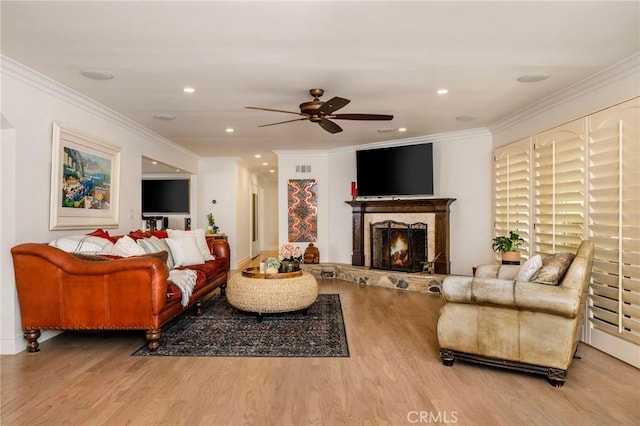 19151 Fowler Ave, North Tustin, CA 92705 - living area with wood finished floors, a ceiling fan, a warm lit fireplace, ornamental molding, and recessed lighting