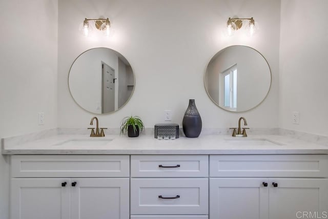 bathroom featuring double vanity