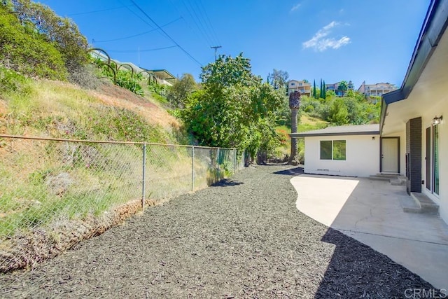 fenced backyard featuring a patio