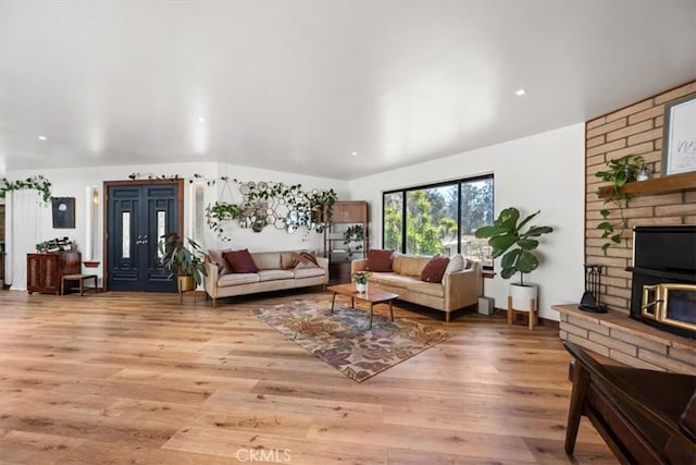 636 Jameson, Arroyo Grande, CA 93420 - living room featuring light wood-style flooring, vaulted ceiling, a brick fireplace, and recessed lighting