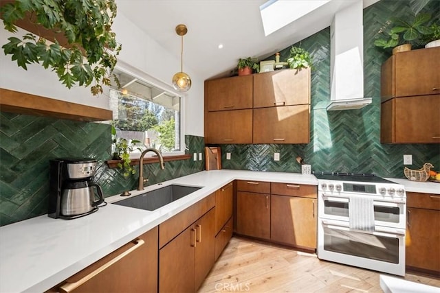 636 Jameson, Arroyo Grande, CA 93420 - kitchen with a sink, range with two ovens, a skylight, lofted ceiling, and decorative backsplash