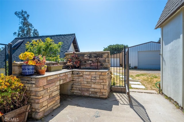 636 Jameson, Arroyo Grande, CA 93420 - view of patio / terrace featuring a gate, an outdoor structure, and a garage