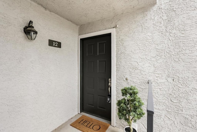 14936 Avenida Venusto Unit 12, San Diego, CA 92128 - view of exterior entry featuring stucco siding