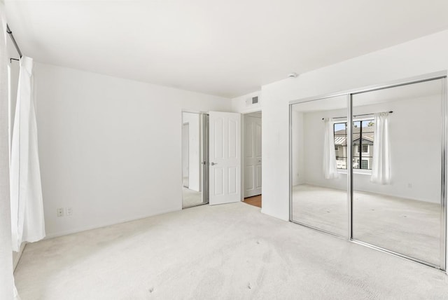 14936 Avenida Venusto Unit 12, San Diego, CA 92128 - unfurnished bedroom with carpet floors and a closet