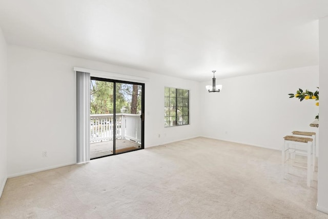 14936 Avenida Venusto Unit 12, San Diego, CA 92128 - carpeted empty room with a chandelier and baseboards