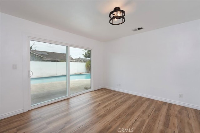 15821 Willett Ln, Huntington Beach, CA 92647 - unfurnished room with wood finished floors and baseboards