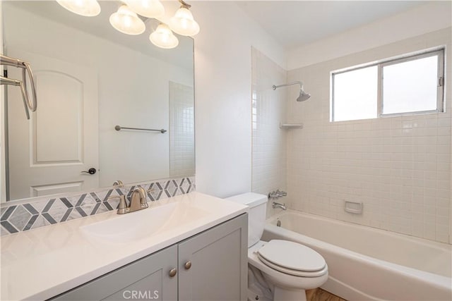 15821 Willett Ln, Huntington Beach, CA 92647 - full bathroom featuring toilet, shower / bathtub combination, vanity, and a chandelier