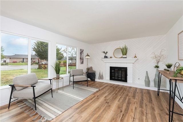 15821 Willett Ln, Huntington Beach, CA 92647 - living area featuring a fireplace, wood finished floors, and baseboards