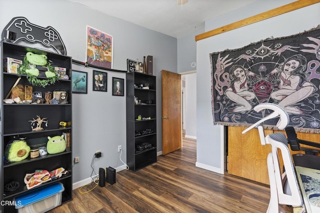 office space with wood finished floors and baseboards