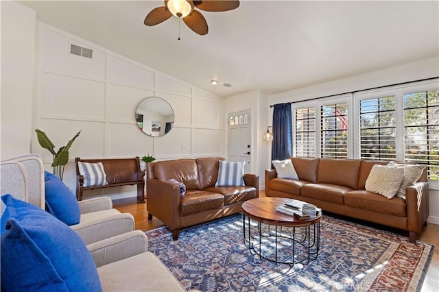 41488 Yankee Run Ct, Temecula, CA 92591 - living area featuring wood finished floors, vaulted ceiling, ceiling fan, and a decorative wall