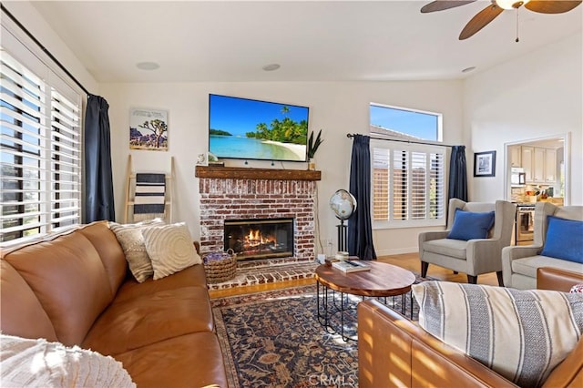 41488 Yankee Run Ct, Temecula, CA 92591 - living area featuring vaulted ceiling, a brick fireplace, ceiling fan, wood finished floors, and baseboards