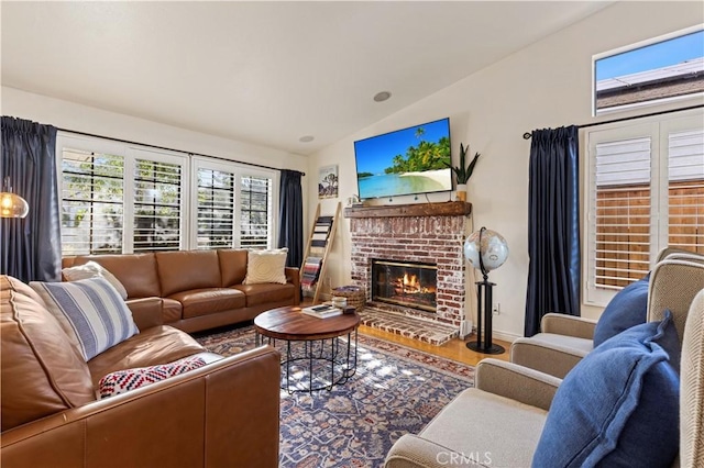 41488 Yankee Run Ct, Temecula, CA 92591 - living area with vaulted ceiling, a brick fireplace, wood finished floors, and baseboards