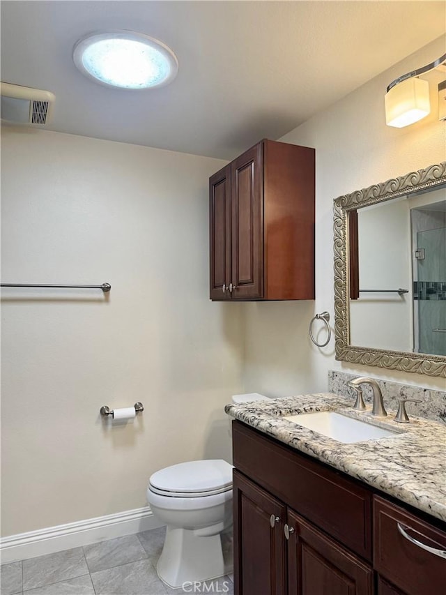 2147 Ronda Granada Unit A, Laguna Woods, CA 92637 - bathroom featuring baseboards, toilet, and vanity