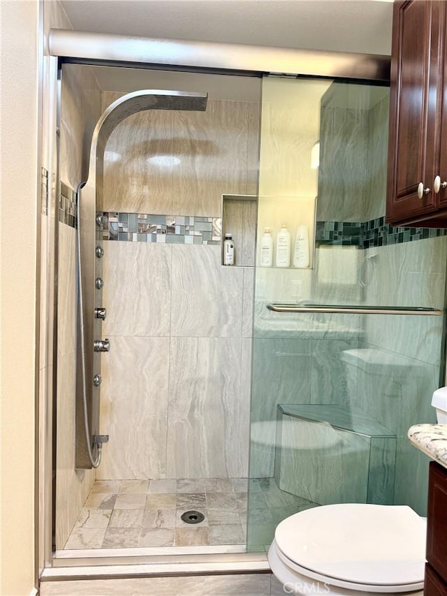 2147 Ronda Granada Unit A, Laguna Woods, CA 92637 - full bathroom featuring a shower stall, vanity, and toilet