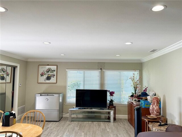 2147 Ronda Granada Unit A, Laguna Woods, CA 92637 - living room featuring plenty of natural light, light wood-style floors, crown molding, baseboards, and recessed lighting