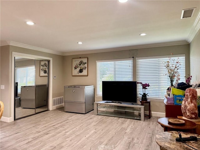 2147 Ronda Granada Unit A, Laguna Woods, CA 92637 - living area with baseboards, plenty of natural light, ornamental molding, light wood-type flooring, and recessed lighting