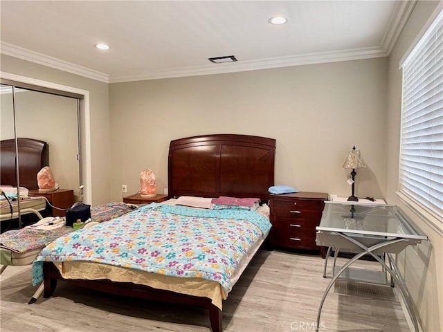 2147 Ronda Granada Unit A, Laguna Woods, CA 92637 - bedroom featuring light wood finished floors, crown molding, a closet, and recessed lighting