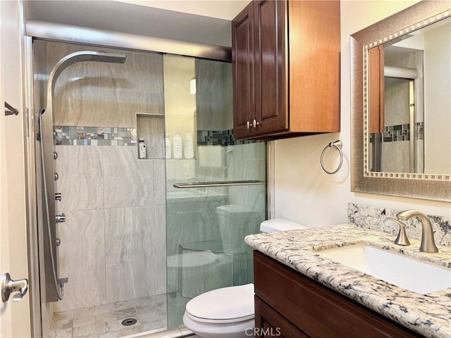 2147 Ronda Granada Unit A, Laguna Woods, CA 92637 - bathroom with a shower stall, toilet, and vanity