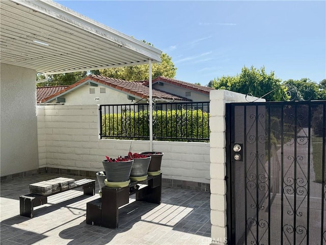 2147 Ronda Granada Unit A, Laguna Woods, CA 92637 - view of patio / terrace with a gate