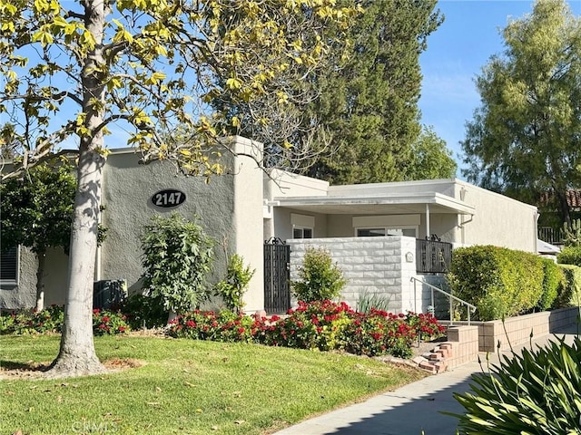 2147 Ronda Granada Unit A, Laguna Woods, CA 92637 - view of side of property featuring stucco siding