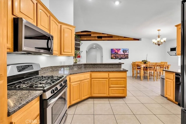 7356 Rubidoux Ave, Yucca Valley, CA 92284 - kitchen featuring stainless steel appliances, lofted ceiling, a peninsula, a chandelier, and light tile patterned floors