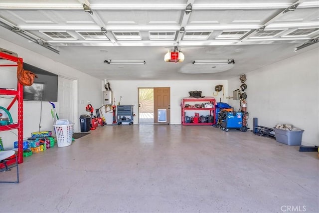 7356 Rubidoux Ave, Yucca Valley, CA 92284 - garage with a garage door opener and water heater