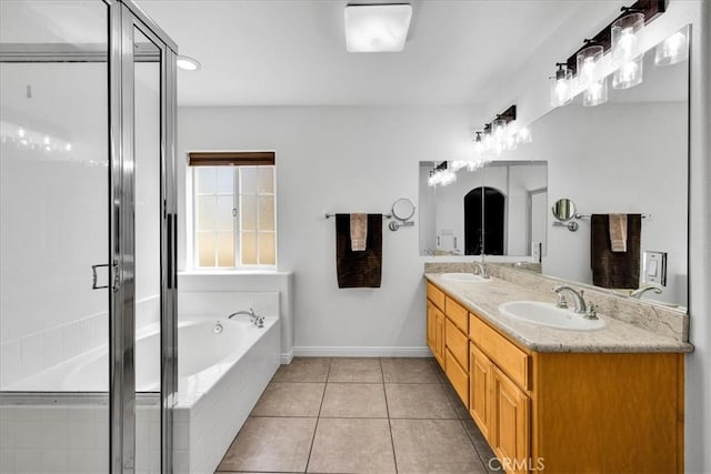 7356 Rubidoux Ave, Yucca Valley, CA 92284 - full bathroom with a bath, a shower stall, tile patterned flooring, double vanity, and baseboards