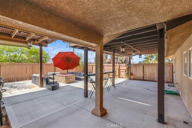 7356 Rubidoux Ave, Yucca Valley, CA 92284 - view of patio featuring an outdoor living space with a fire pit and a fenced backyard