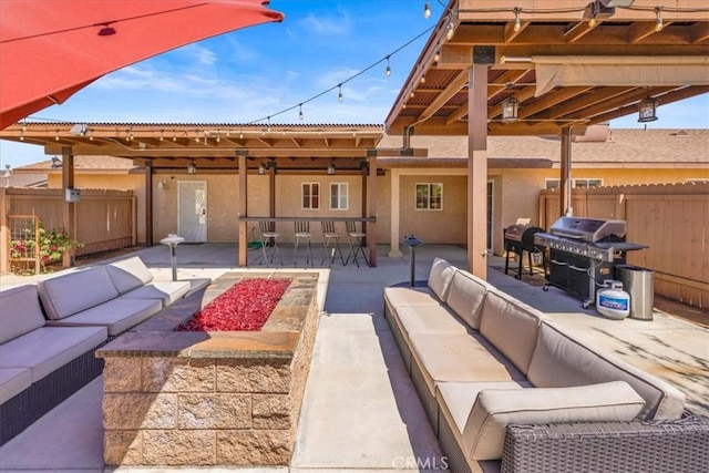 7356 Rubidoux Ave, Yucca Valley, CA 92284 - view of patio featuring an outdoor living space with a fire pit, grilling area, fence, and outdoor dining area