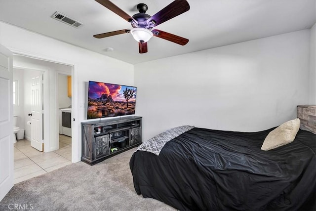7356 Rubidoux Ave, Yucca Valley, CA 92284 - bedroom featuring light tile patterned floors, ensuite bathroom, light carpet, and ceiling fan