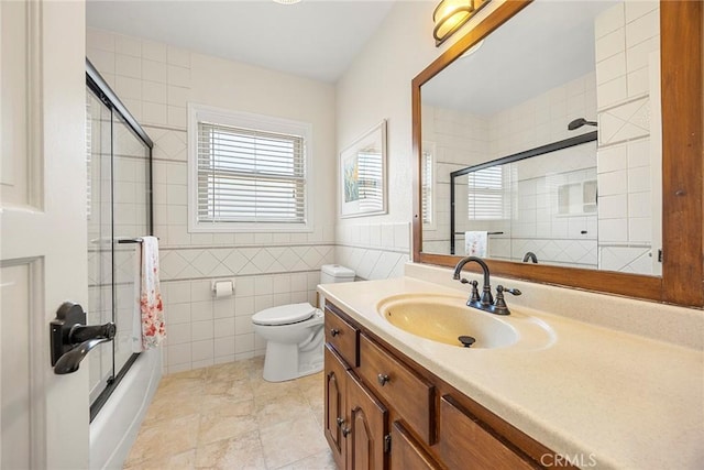 1418 S Cedar Ave, Fullerton, CA 92833 - bathroom with vanity, tile walls, enclosed tub / shower combo, toilet, and tile patterned floors