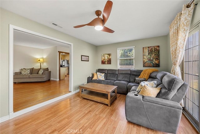 1418 S Cedar Ave, Fullerton, CA 92833 - living room featuring ceiling fan, light wood-style floors, and baseboards