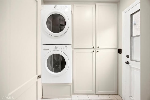1418 S Cedar Ave, Fullerton, CA 92833 - laundry area with stacked washer and clothes dryer, cabinet space, and light tile patterned floors