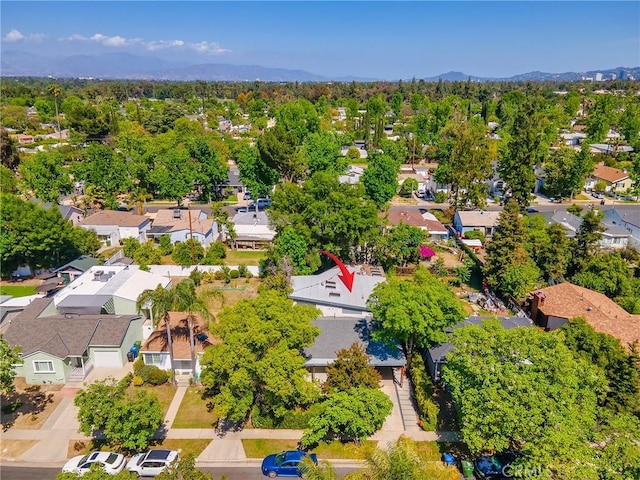 aerial perspective of suburban area featuring a mountainous background