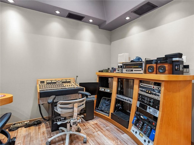 office space featuring wood finished floors, recessed lighting, and baseboards