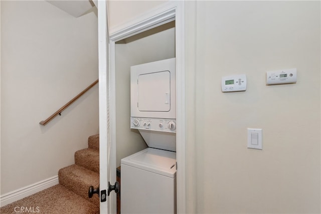 23776 Lakeview Dr, Crestline, CA 92325 - clothes washing area featuring estacked washer and dryer, baseboards, and carpet floors