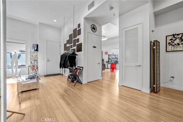 1401 Mission St Unit 105, South Pasadena, CA 91030 - hallway with light wood-style floors, baseboards, a towering ceiling, and recessed lighting