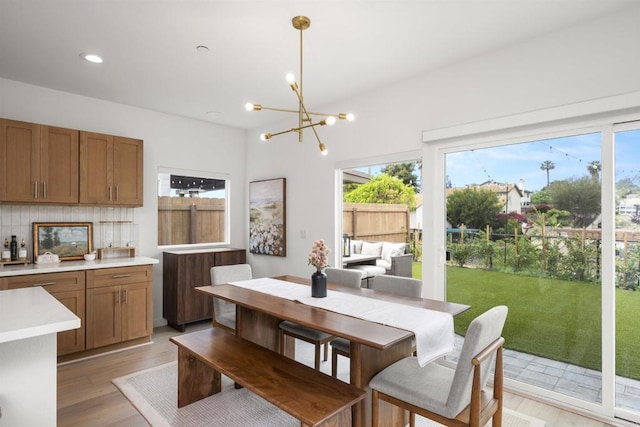 2210 Bonita Ct, Lemon Grove, CA 91945 - dining area with a chandelier, light wood-style floors, and recessed lighting